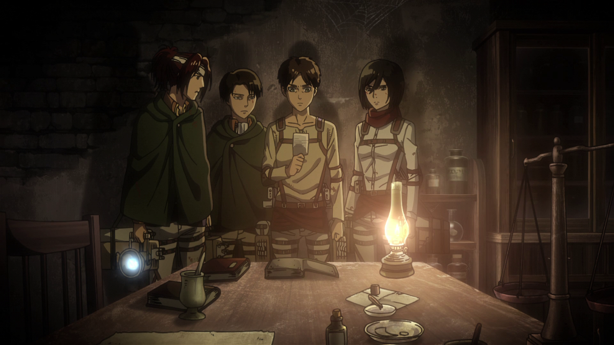 Eren, Levi, Hange e Mikasa osservano la foto di Grisha