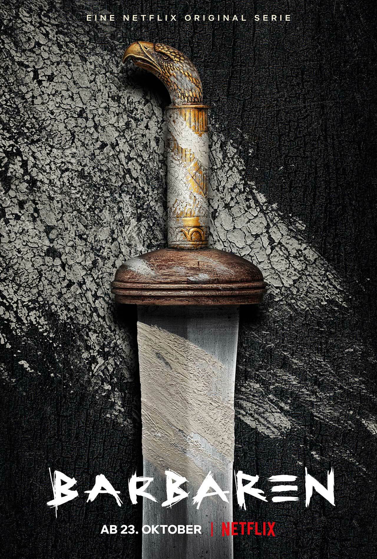 Clicca per vedere l'immagine originale Una spada è pogiata su quello che sembra essere un tavolo di legno