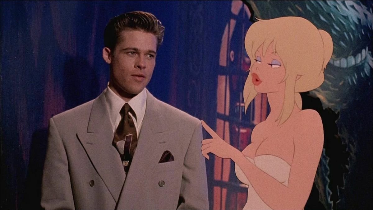 Holli Woyld parla con Brad Pitt nel Mondo Furbo in una scena di Fuga dal mondo dei sogni