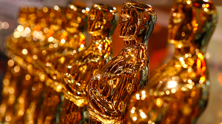 Clicca per vedere l'immagine originale Una fila di lucenti statuette degli Academy Awards