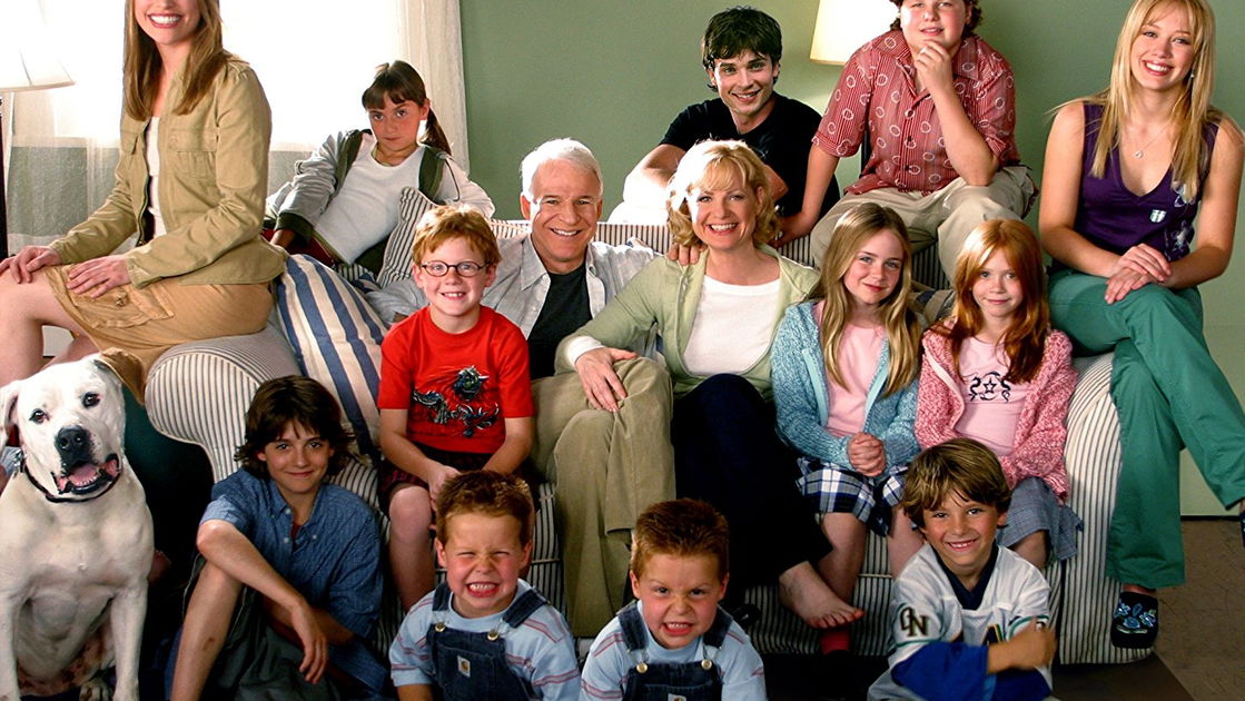 Copertina di Una scatenata dozzina: i film e il cast completo della saga con Steve Martin